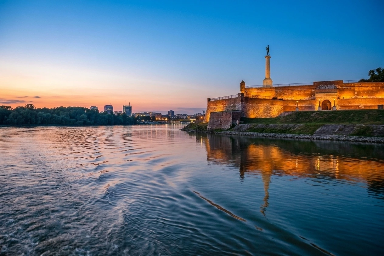 Belgrade Fortress and Kalemegdan view from Danube river cruise at sunset